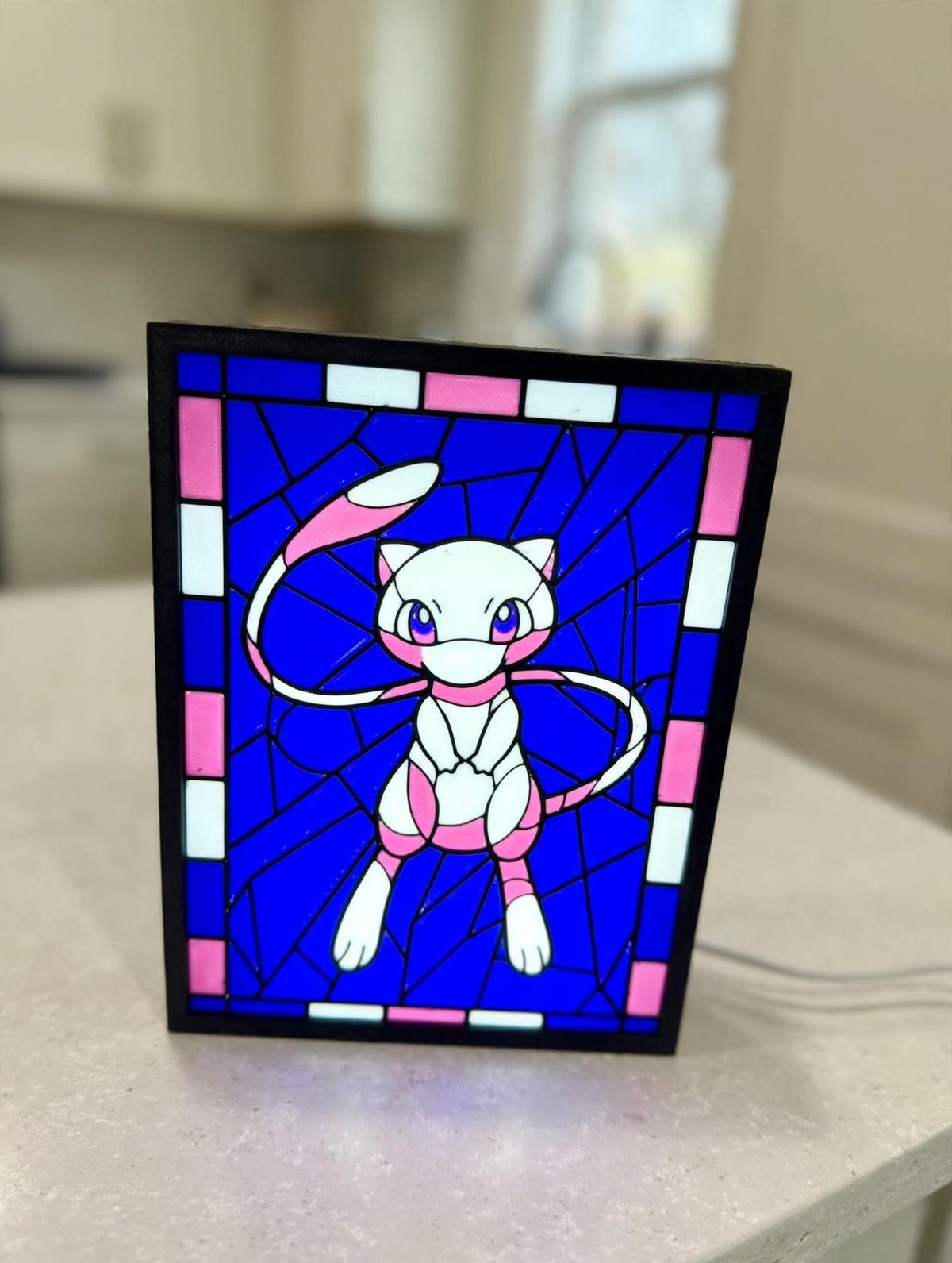 Mew framed stained-glass style display