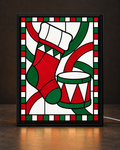 Illustrative CNS Customs Stocking + Drum framed light-up stained-glass-style design on dark countertop, exact owner-approved original art