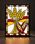 Illustrative CNS Customs Wheat + Corn Harvest framed light-up stained-glass-style design on dark countertop, exact owner-approved original art