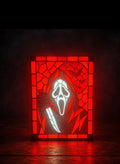 Red Ghostface portrait with geometric border and bats displayed in a black light-up frame