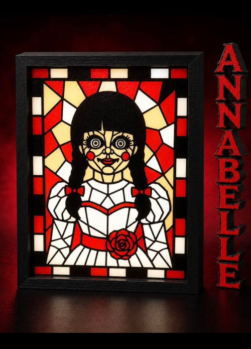 Annabelle portrait in red, cream, white and black with geometric border displayed in a black light-up frame