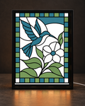 Illustrative CNS Customs Hummingbird & Blossom light-up frame mockup using exact approved V01 artwork, experimental not physically validated