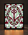 Illustrative framed preview of ornamental burgundy antique key surrounded by mint white filigree in black light-up tabletop frame